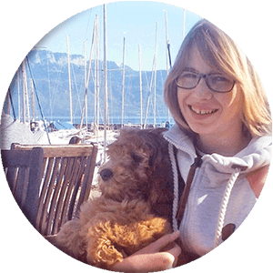 Girl with a puppy in the port, round picture